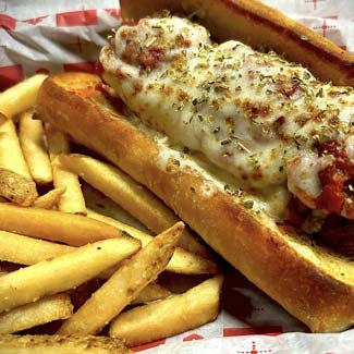 Meatball Italian sandwich and French fries served from food menu at Maloney's Kaukauna WI bar and grill